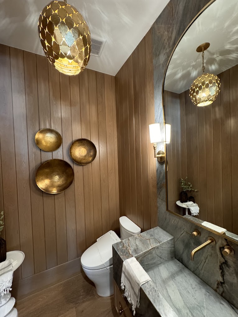 Custom powder room with marble vanity and gold fixtures - luxury bathroom Riverside